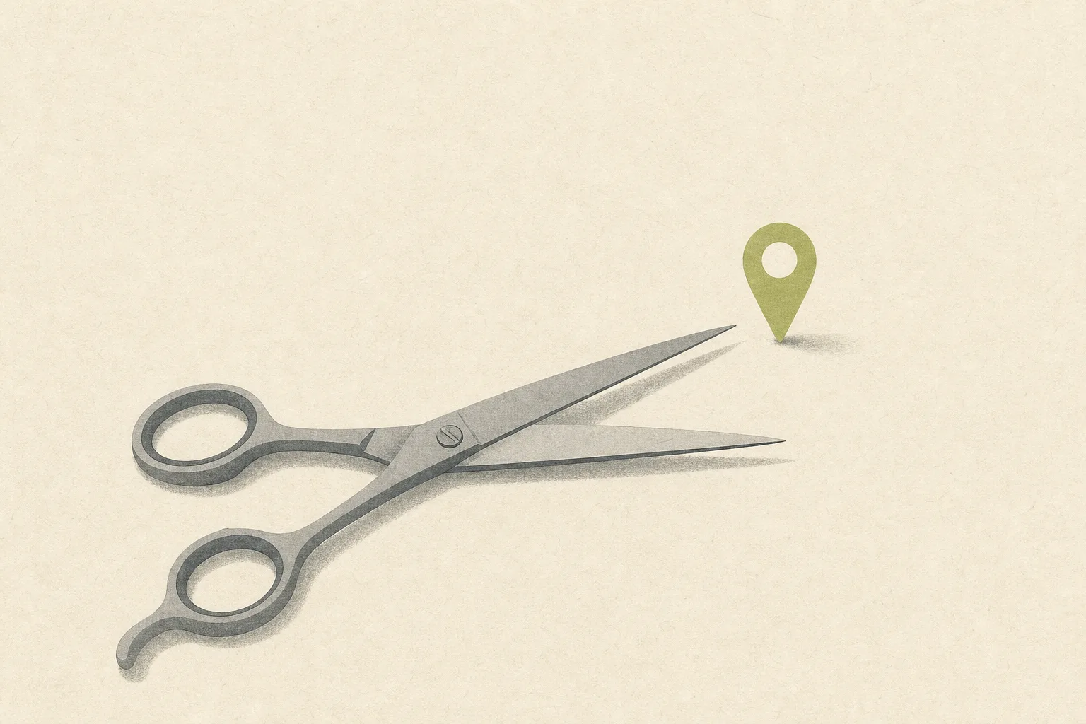 A single pair of open grey hairdressing scissors resting on a bone-cream ground, one small acid green map pin standing upright just beyond the blade tips.
