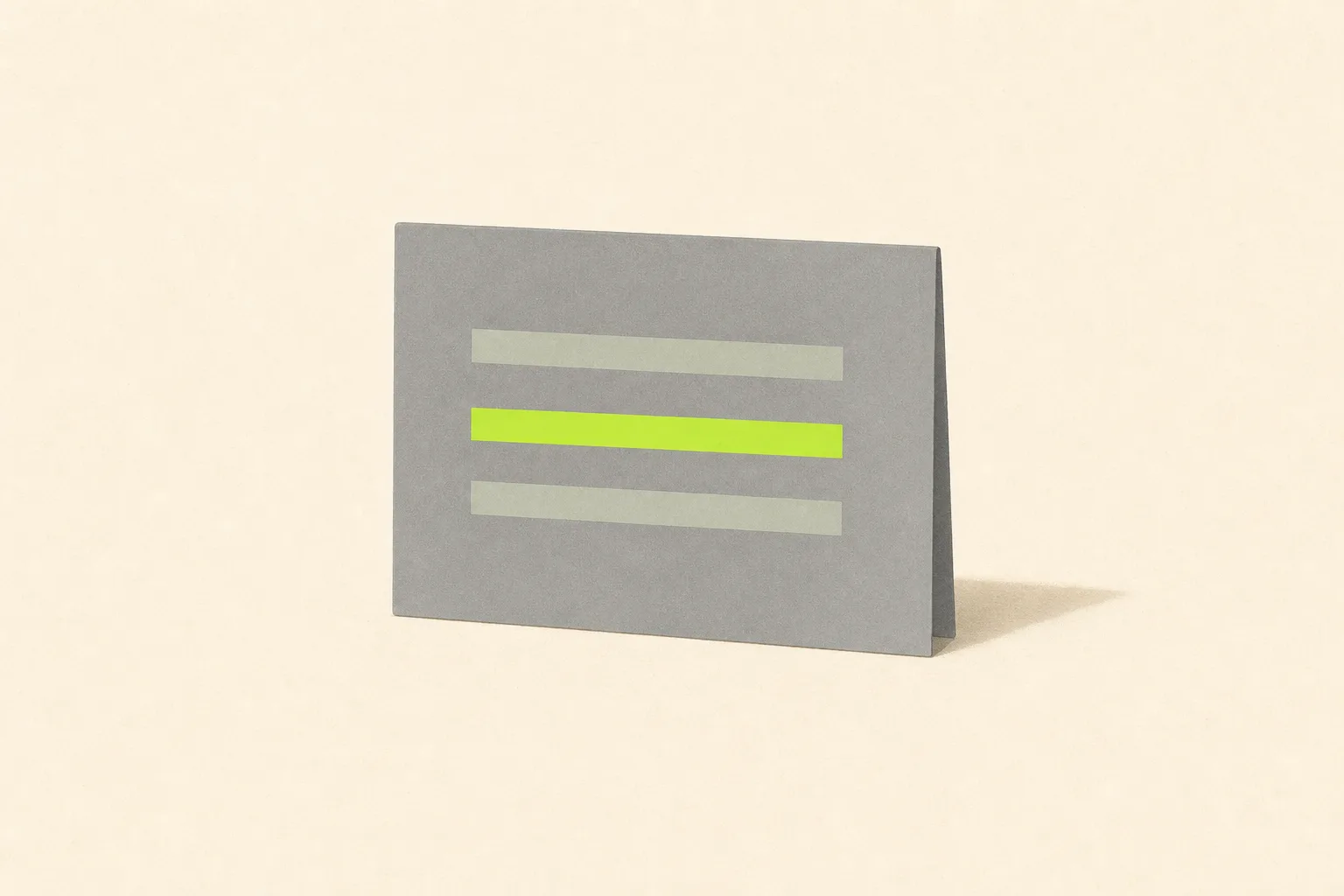 A plain grey index card standing upright on a bone-cream ground, three short sage-grey bars across its face like lines of information, the middle bar redrawn in solid acid green as though singled out for review.